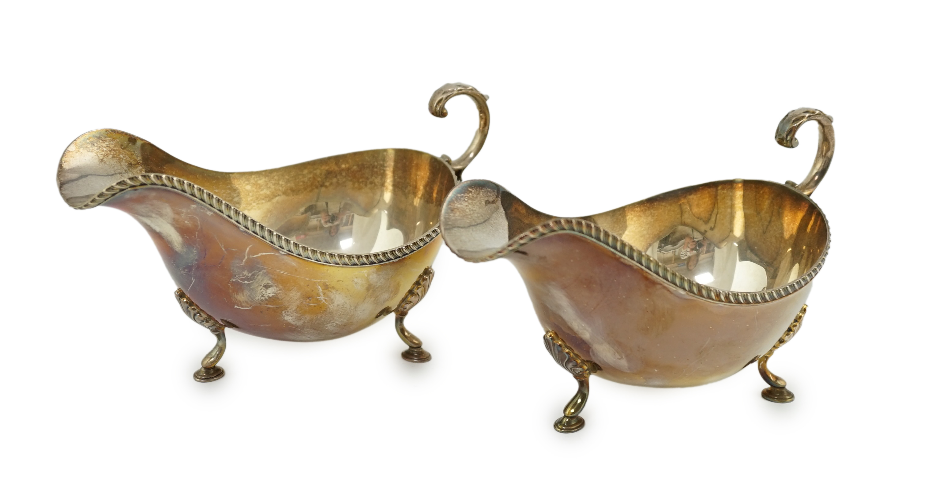 A pair of Elizabeth II silver sauce boats, by Barker Brothers Silver Ltd